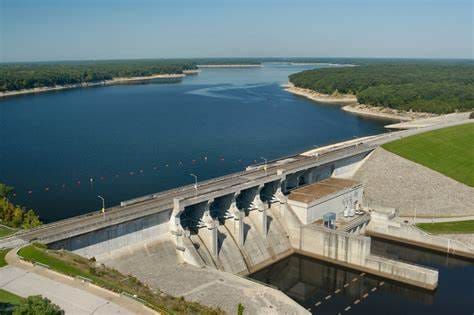 An aerial view of a dam and spillway on a lake
